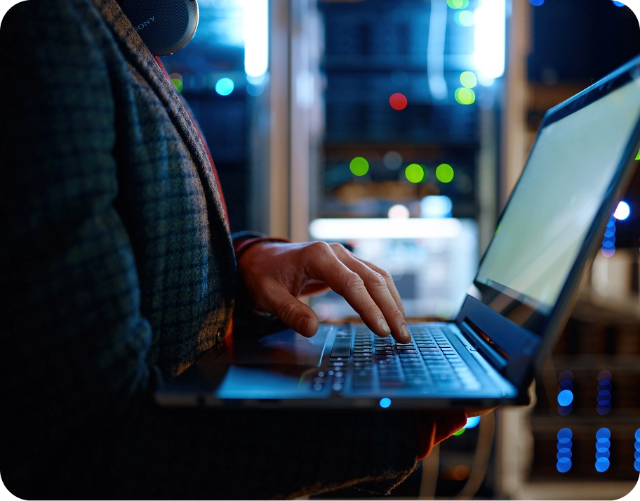 IT person working on laptop