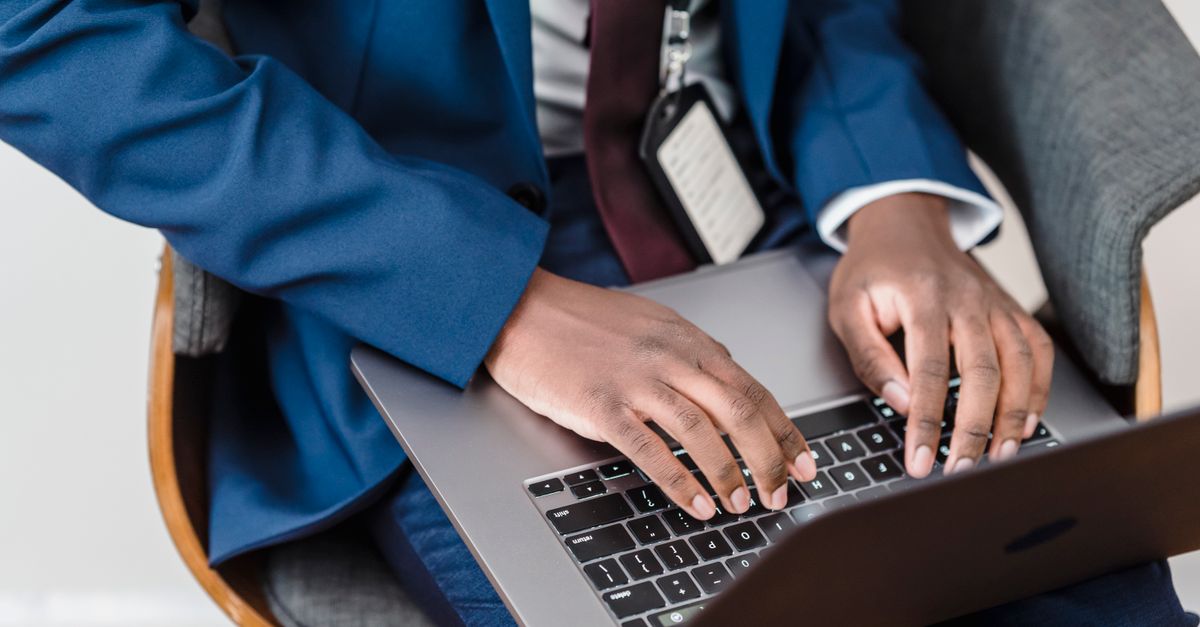 Small business employee in a Boston office checking Microsoft 365 email on a laptop