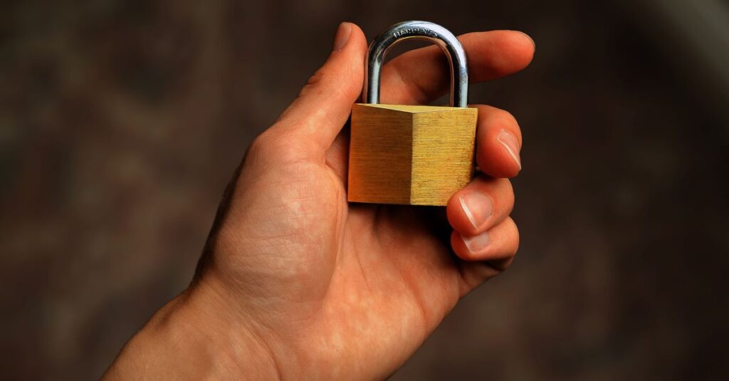 Padlock icon overlaid on an email inbox screen representing DMARC email authentication
