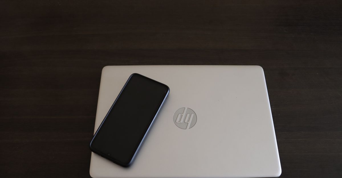 IT technician updating a Windows 11 laptop in a small business office
