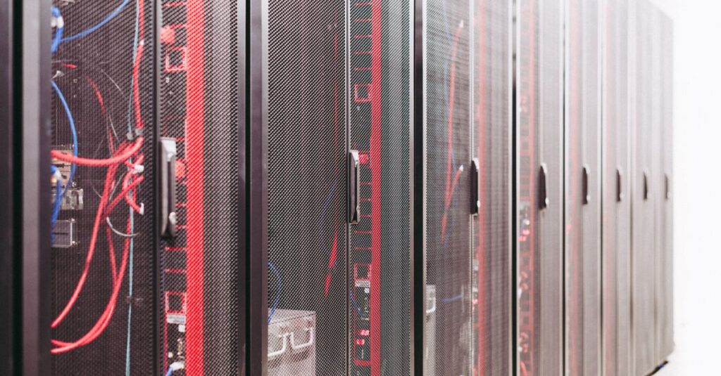 IT technician checking server hardware in a data center, representing Windows Server 2022 reaching end of mainstream support