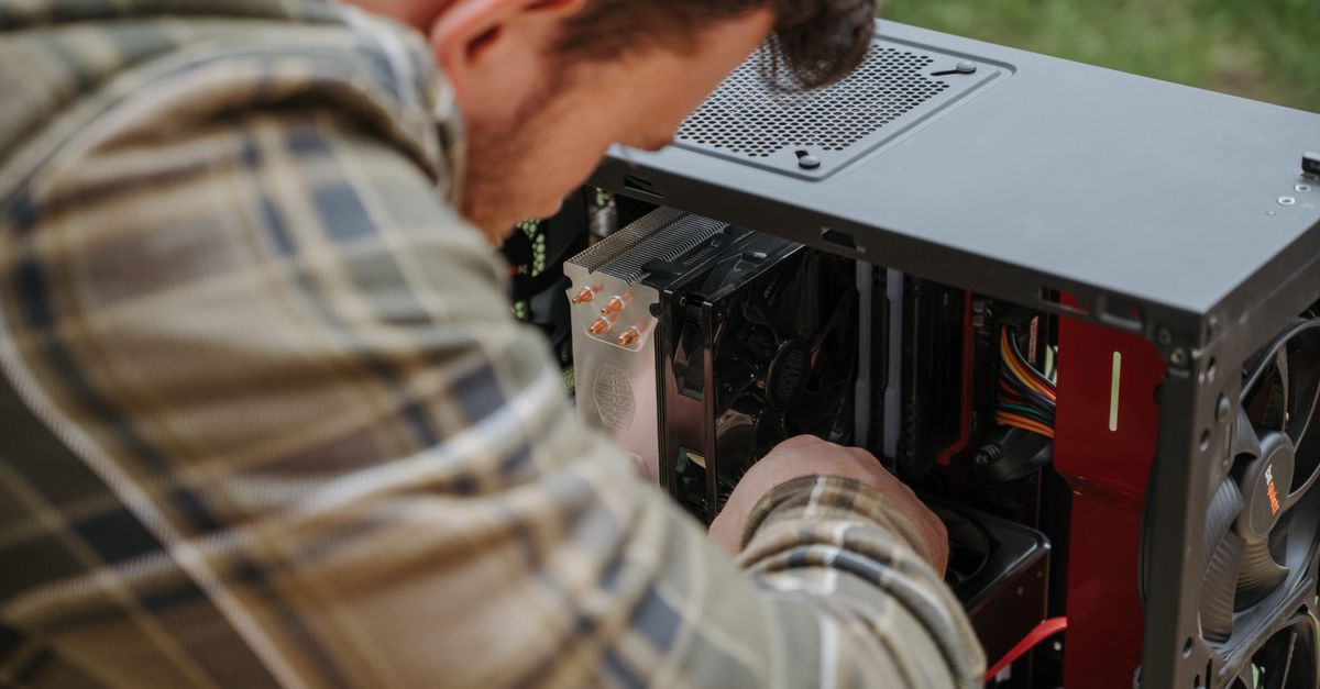 IT technician replacing an aging Windows laptop in a small Boston office