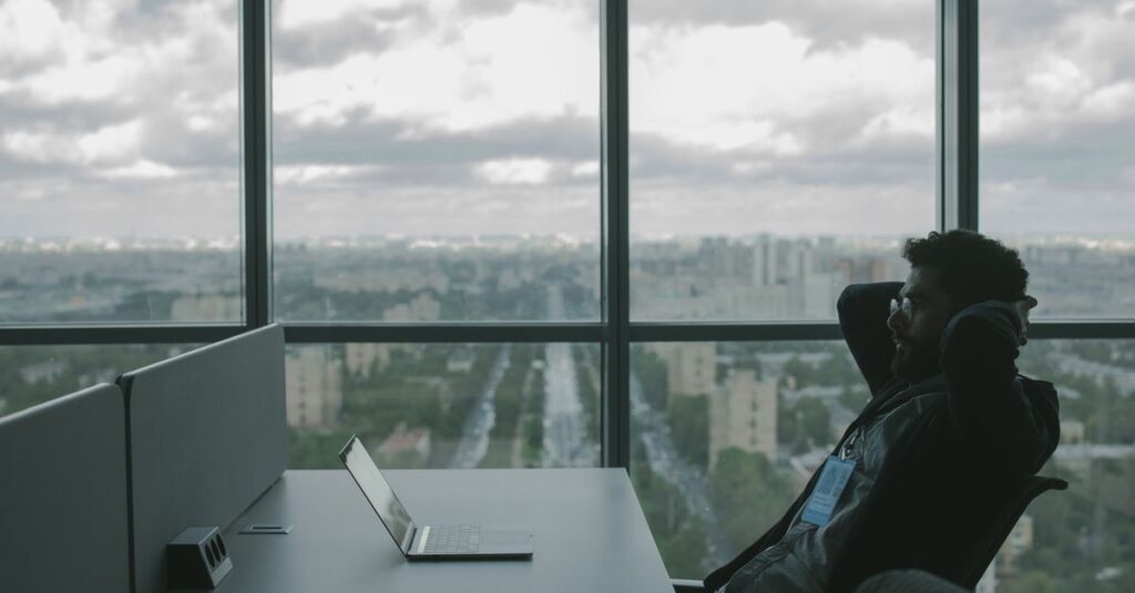 Small business employees reviewing cybersecurity practices on a laptop in an office